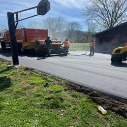D. Lee's Paving crew working on a driveway